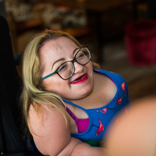 gemma laughing amongst a group of friends