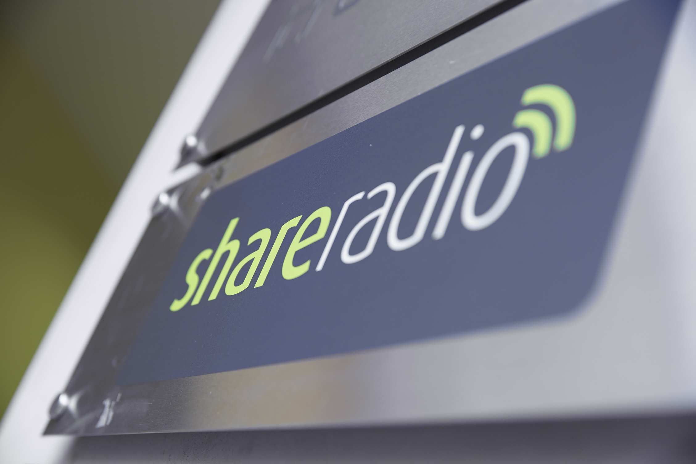 Share Radio logo on a sign