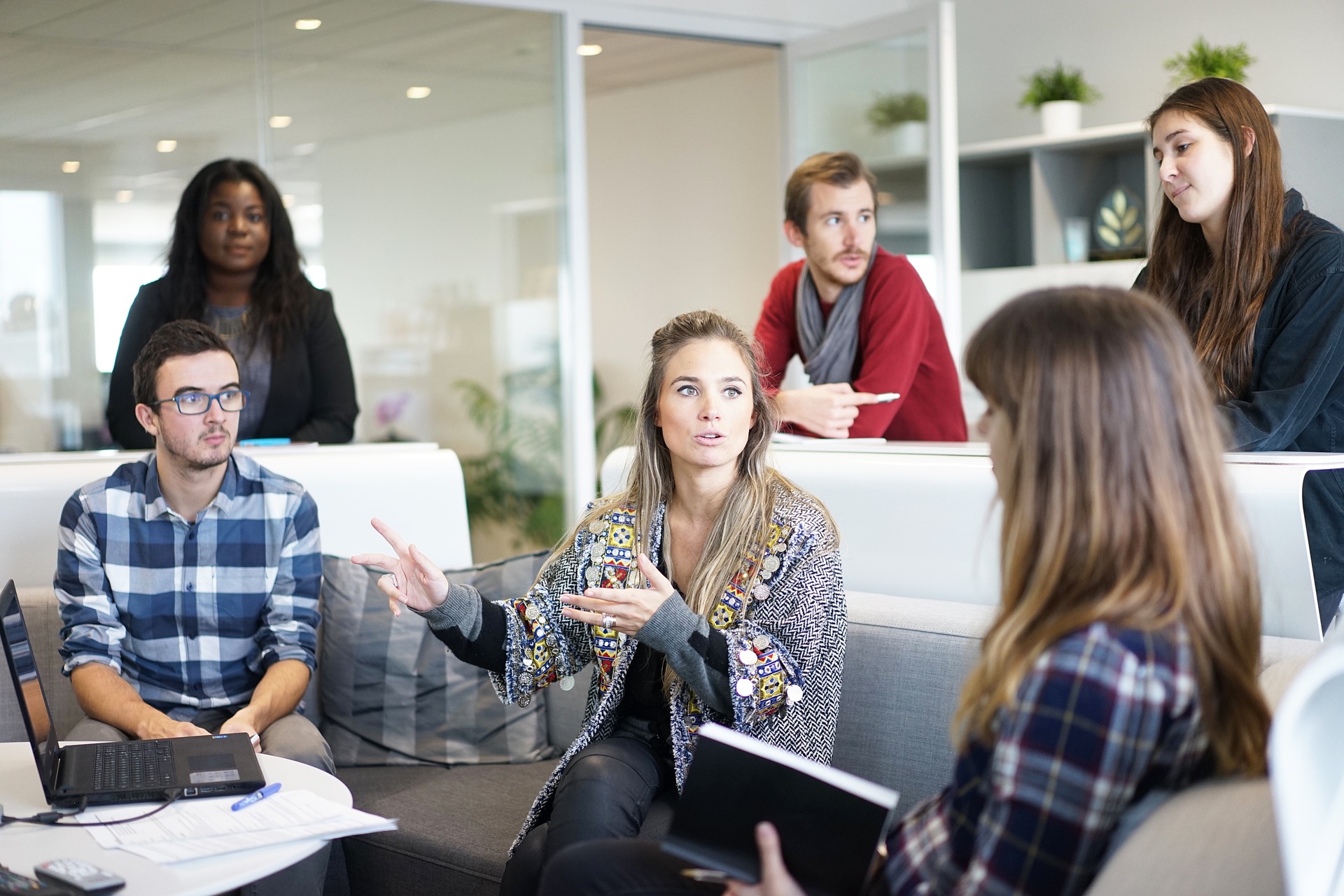 a team of people in a workplace setting talking